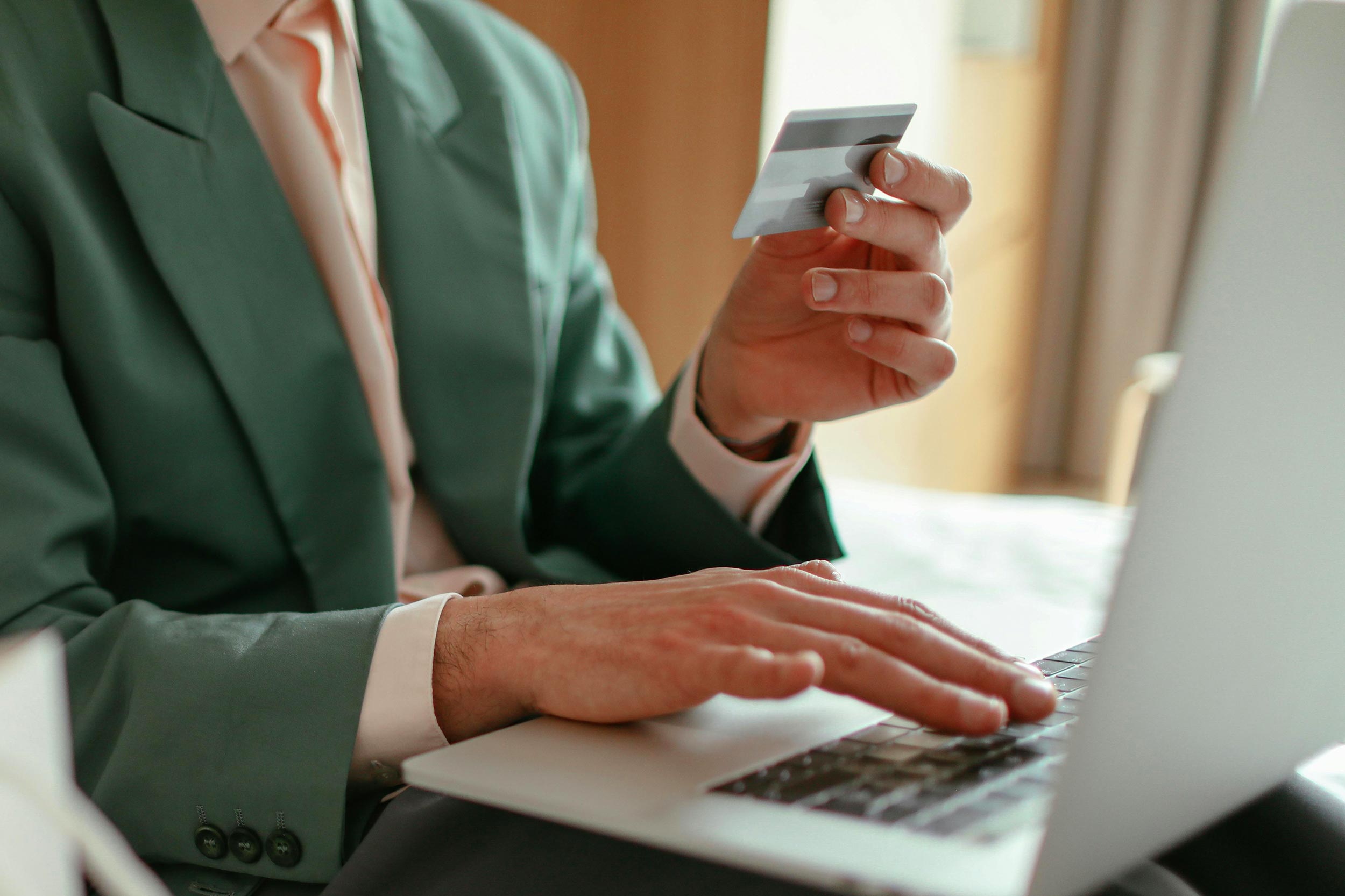 Person using credit card to pay online